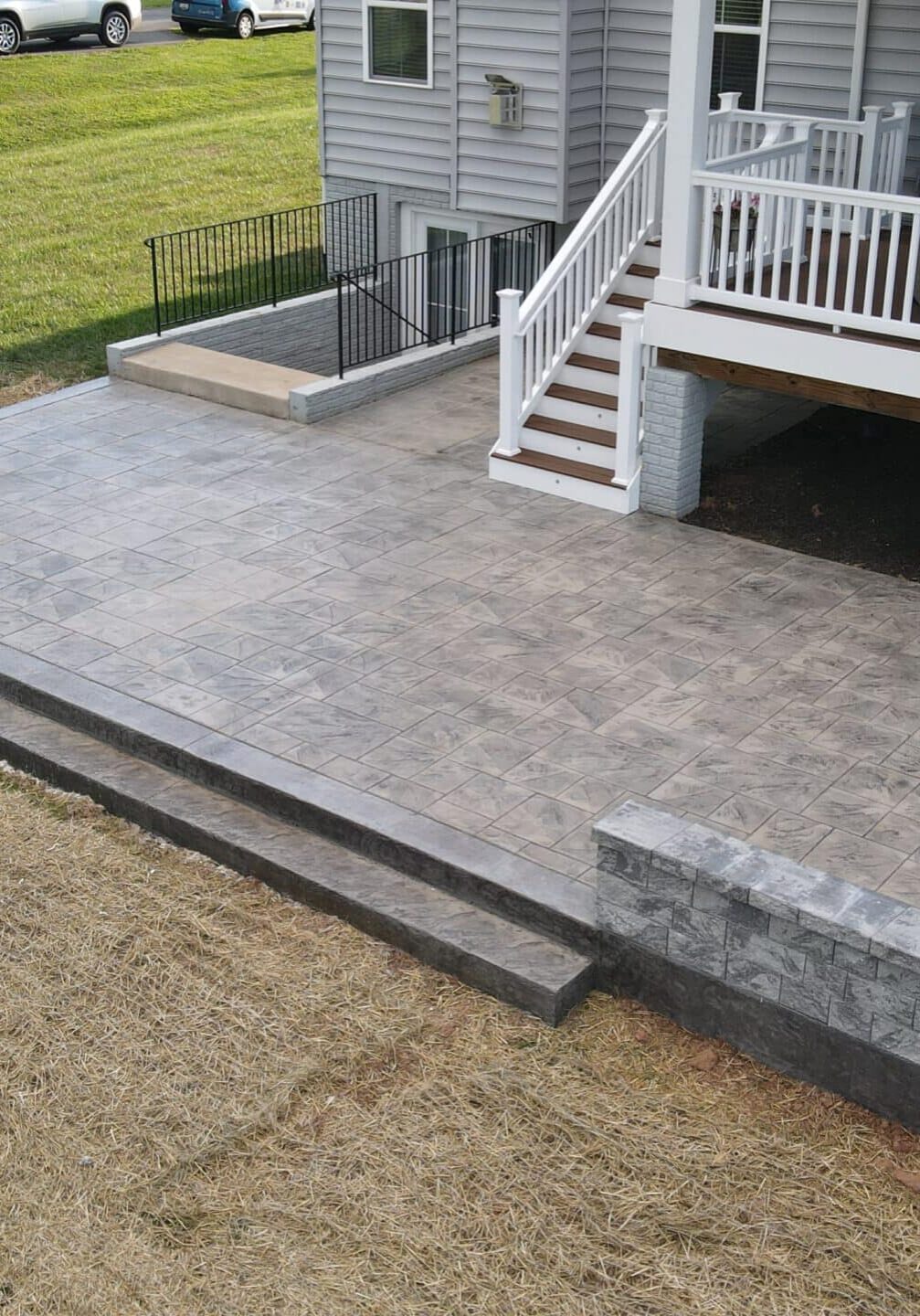 Hardscaping in Fairfax Detailed stonework on a new outdoor living area, showcasing Hardscaping in Fairfax